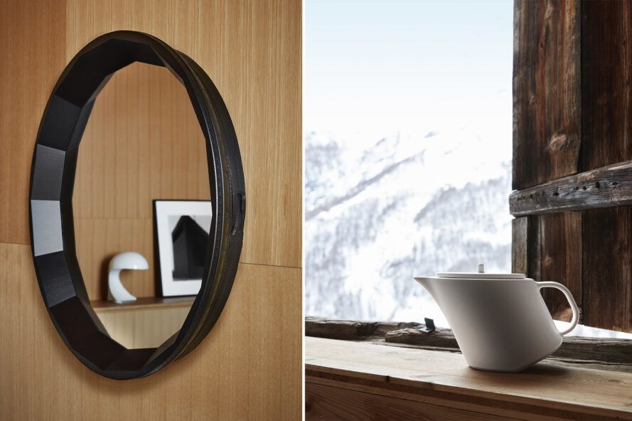 Left, oval mirror with black frame. By the way, the white teapot by the window.