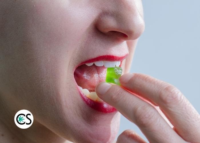 woman eating CBD gummies