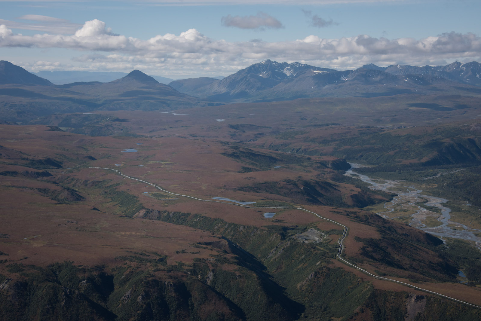 an aerial view of a brown mountainous landscape