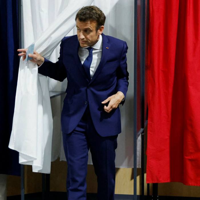 Emmanuel Macron leaves polling place