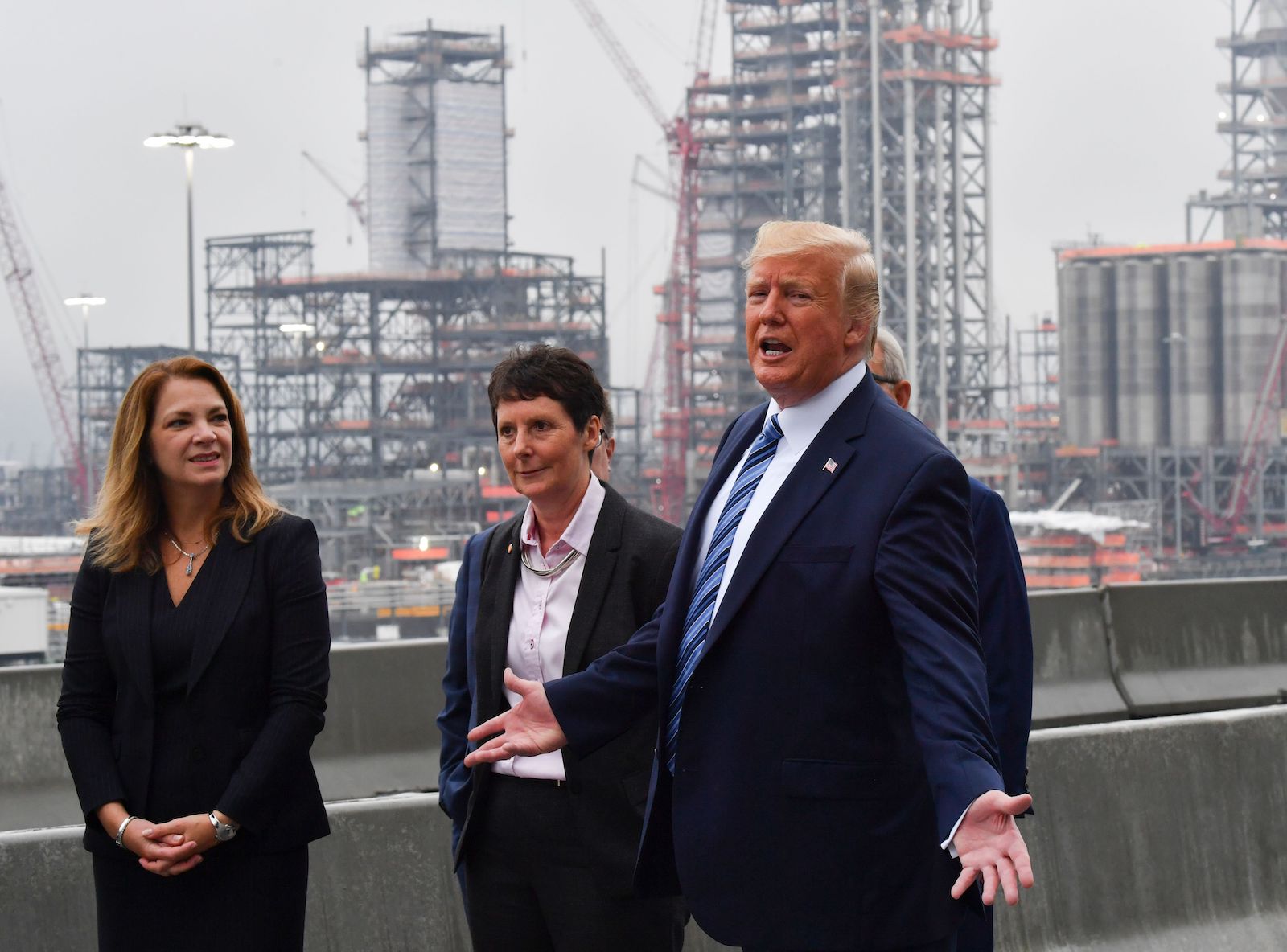 U.S. President Donald Trump, with Shell Oil company President Gretchen Watkins (L) and Shell Pennsylvania Vice President Hilary Mercer (C), tours the Shell Pennsylvania Petrochemicals Complex in Monaca, Pennsylvania, on August 13, 2019.