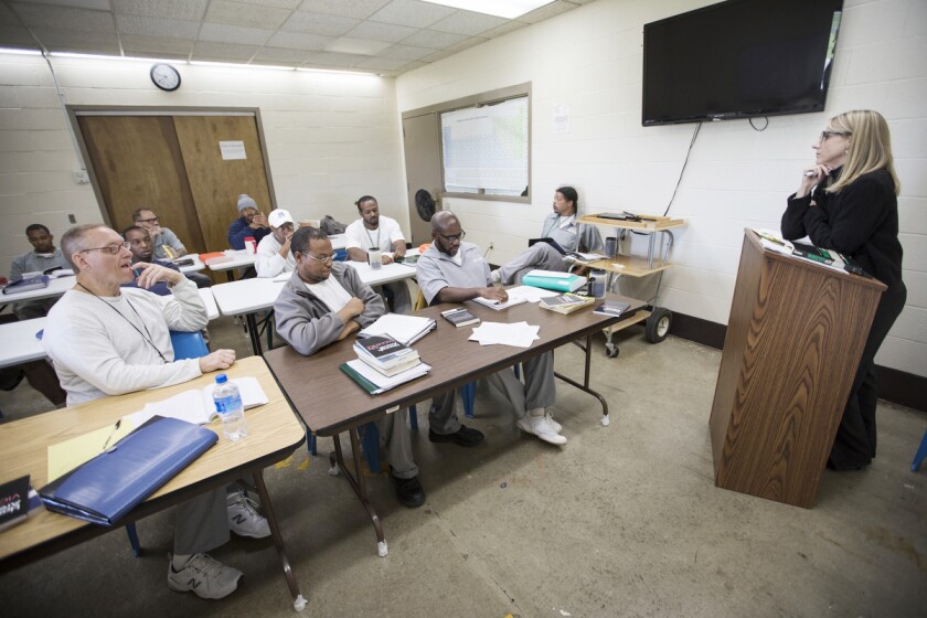 A group of incarcerated students participate in WashU’s Prison Education Project in 2017. At that time, the program relied on printed resources versus digital tools.