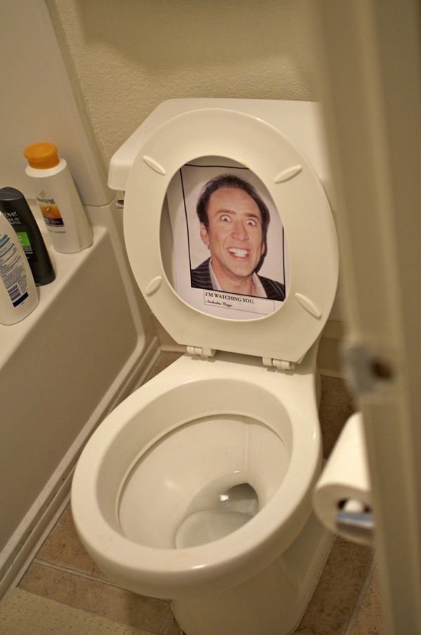 Office prank with picture of Nicolas Cage on toilet seat