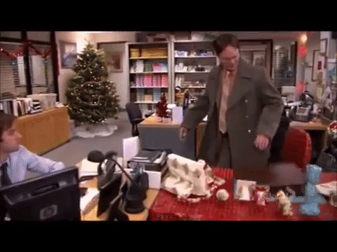 Office's Dwight Schluter sits on gift-wrapped chair when it collapses